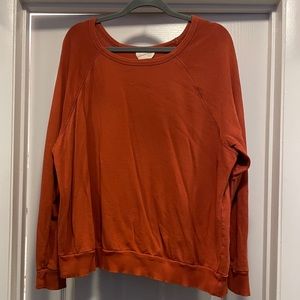 Orange crewneck sweatshirt